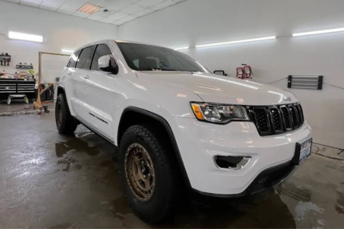 White Jeep cleaned and detailed inside auto shop