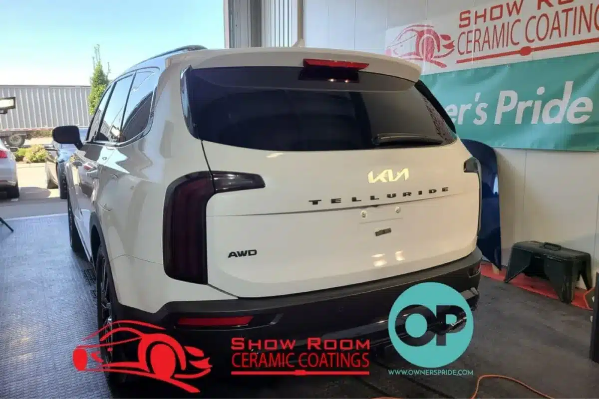 White Kia Telluride with ceramic coating parked indoors