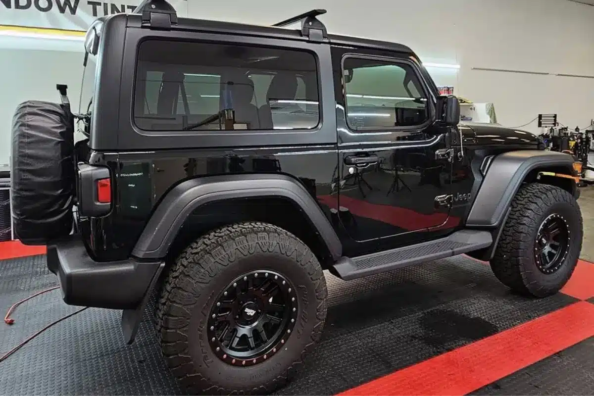 Black Jeep Wrangler with glossy paint correction finish