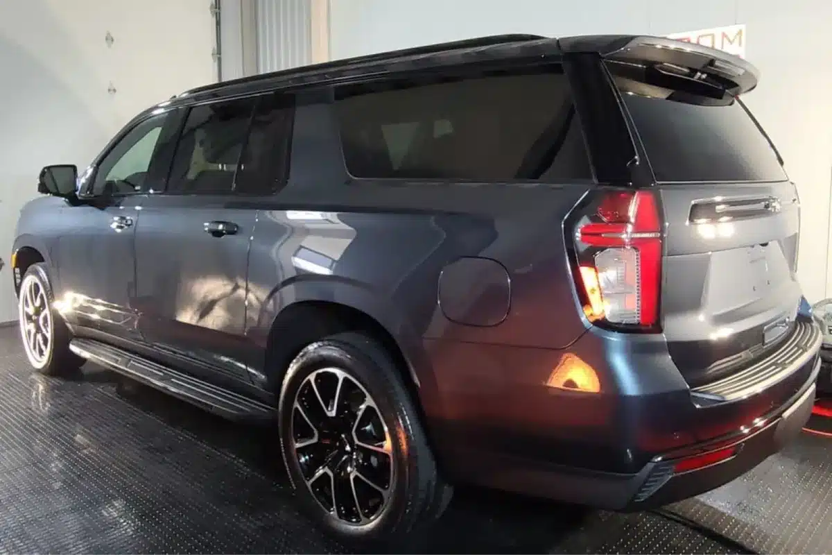 Gray SUV with tinted windows after window tinting service.