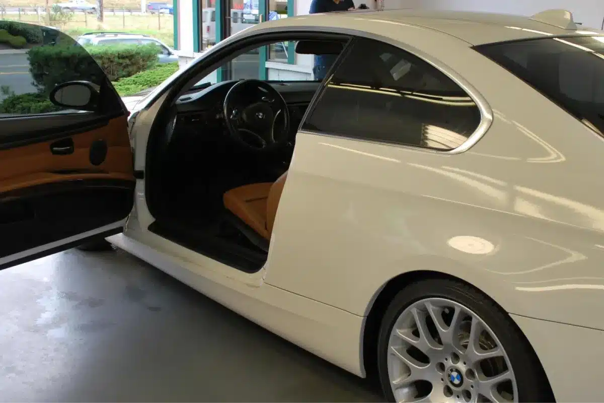 White BMW coupe interior cleaned during car detailing.