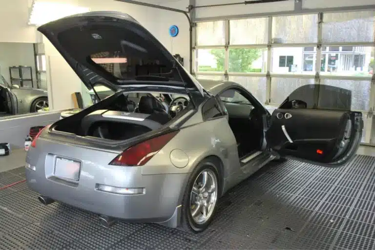 Silver Nissan sports car interior and exterior cleaned during car detailing.