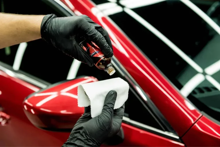 Technician preparing ceramic coating for application.